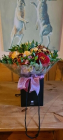Hand Tied Bouquet in Rich Seasonal Colours in an Aqua Pack   Florist's Choice