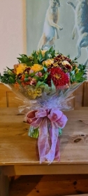 Hand Tied Bouquet in Rich Seasonal Colours in an Aqua Pack   Florist's Choice